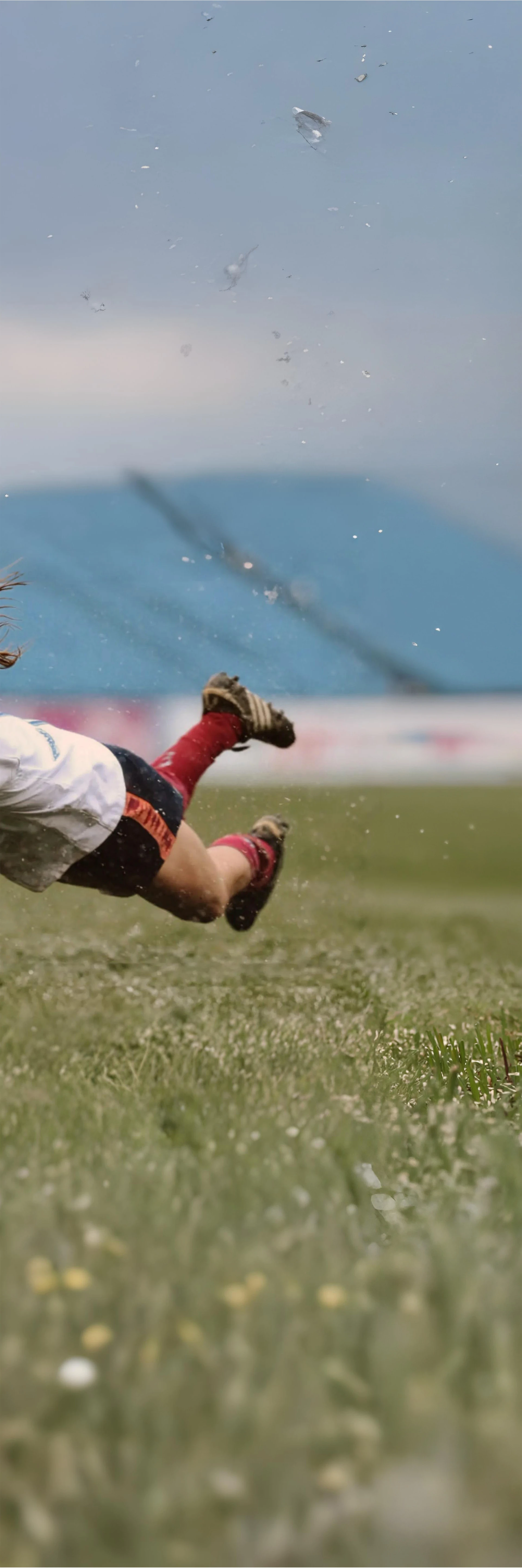 Female rugby player diving