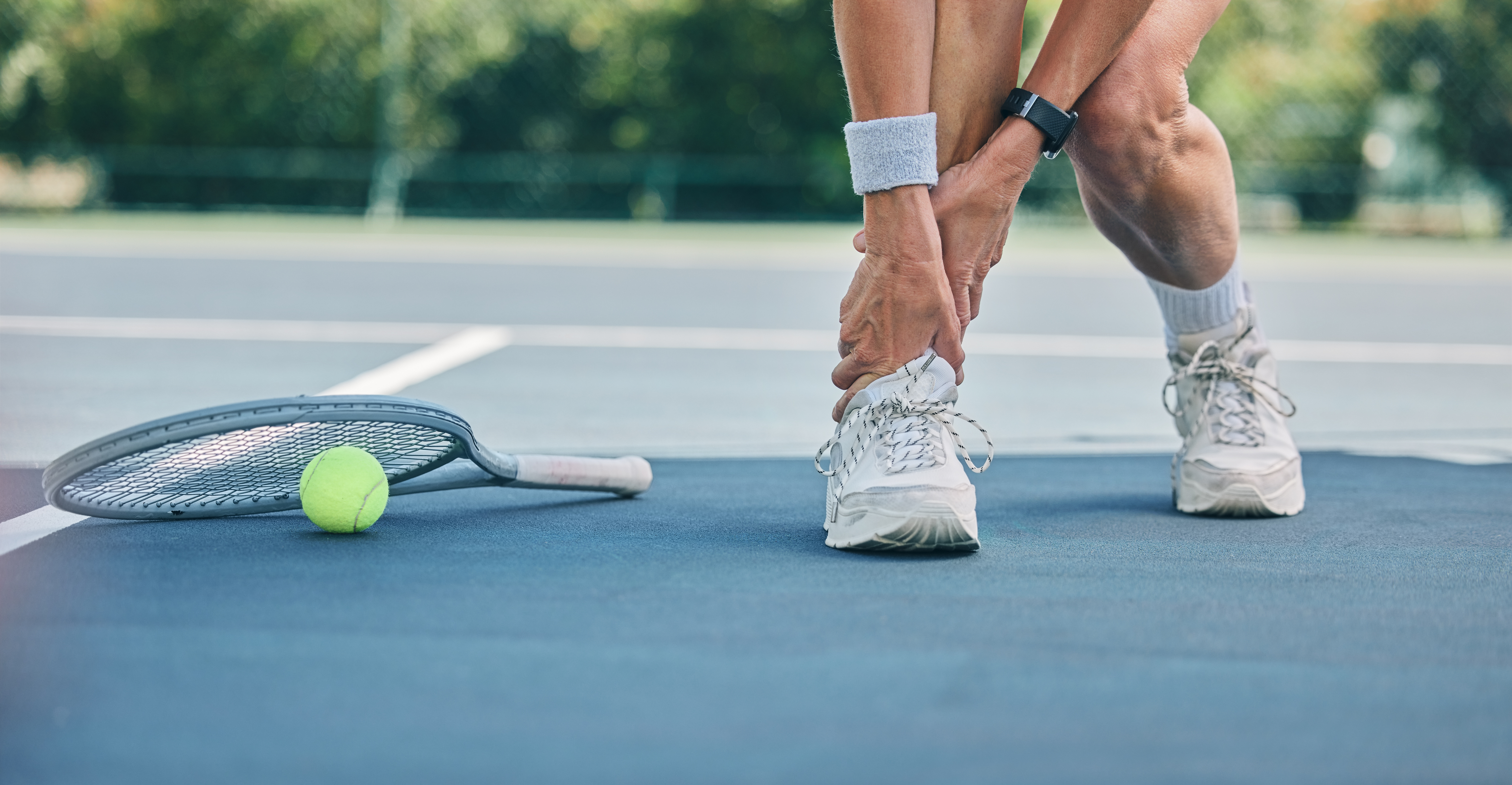 Tennis player or woman with ankle pain on sports ground for healthcare risk, muscle accident or training problem. Competition, game and athlete on fitness court with foot injury and legs massage.